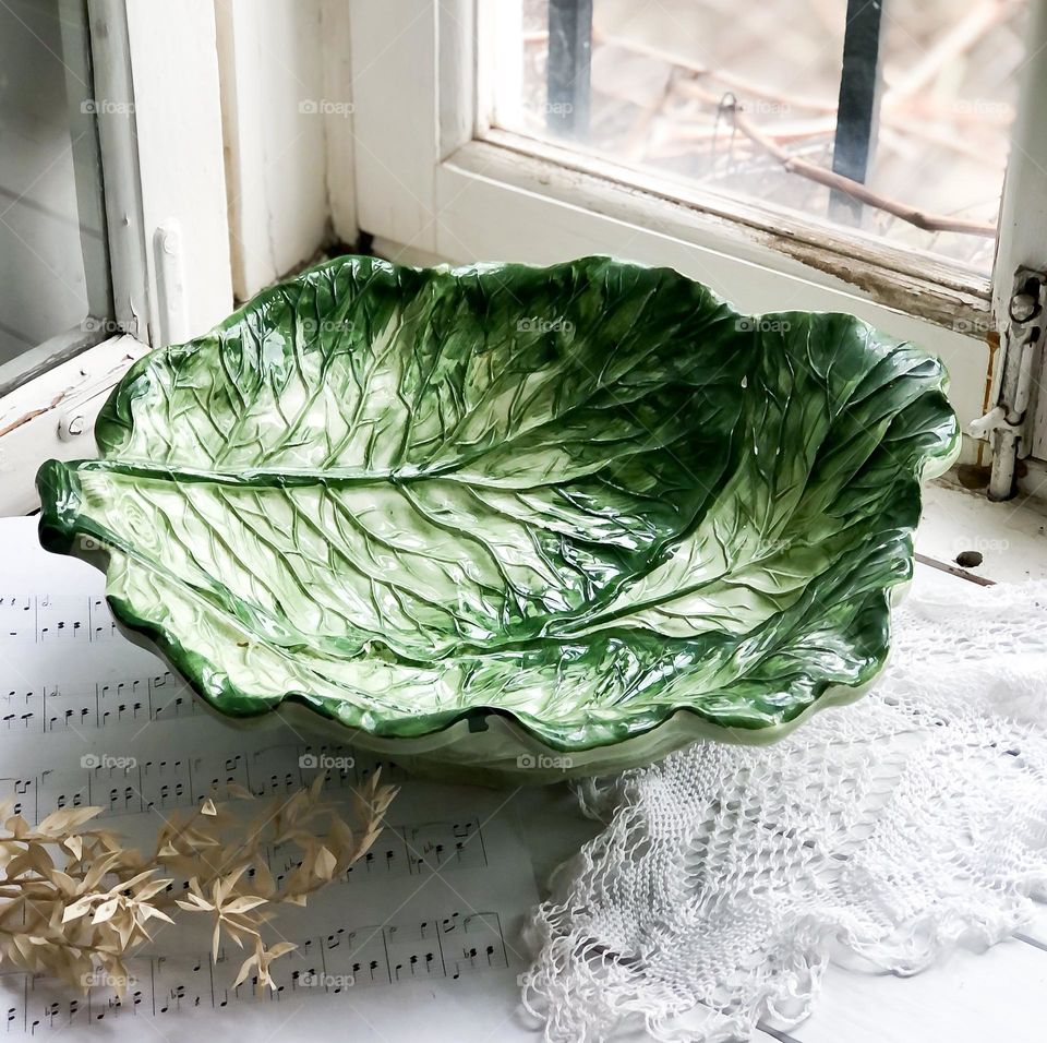 Antique deep dish in the shape of cabbage leaves