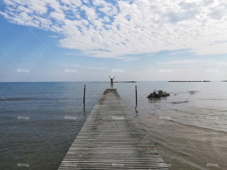 man jump on The pier