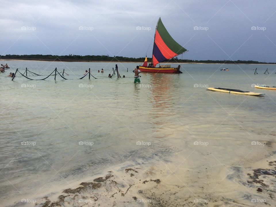 A fishing sail raft in a lagoon connected to the ocean in Jericoacoara in Brazil 