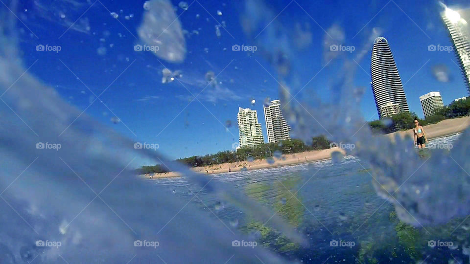 Surf waves framed around a lady