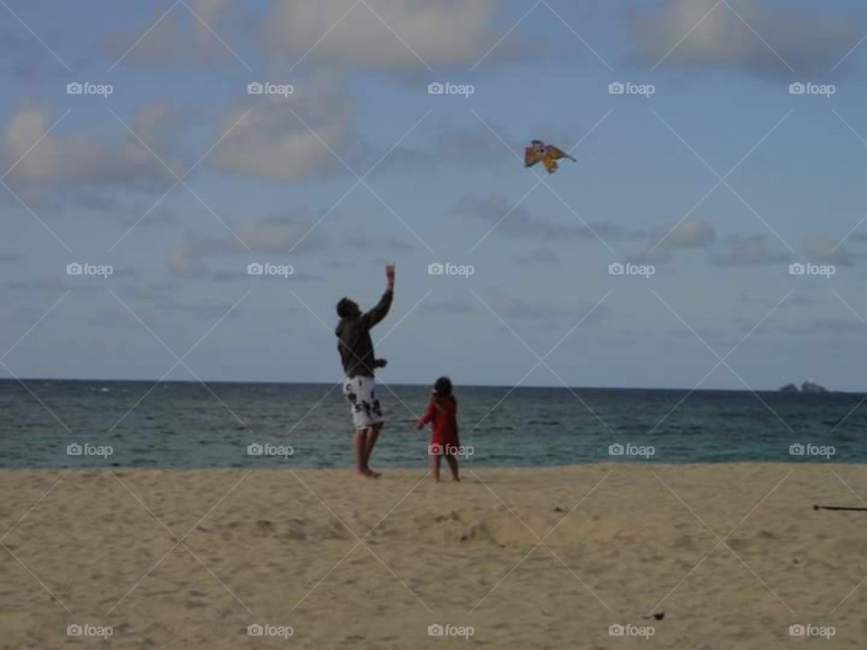kite flying on the beach,
father and daughter , bonding, 

 little girl , man, , parents and daughter . looking forwards , carvis bay, cornwall, South,  West,  of, England,  United Kingdom,  of, great Britain,  
summer time, sunshine
