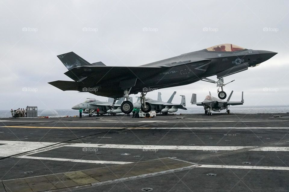 A F35 Lightning II lands aboard the USS Abraham Lincoln