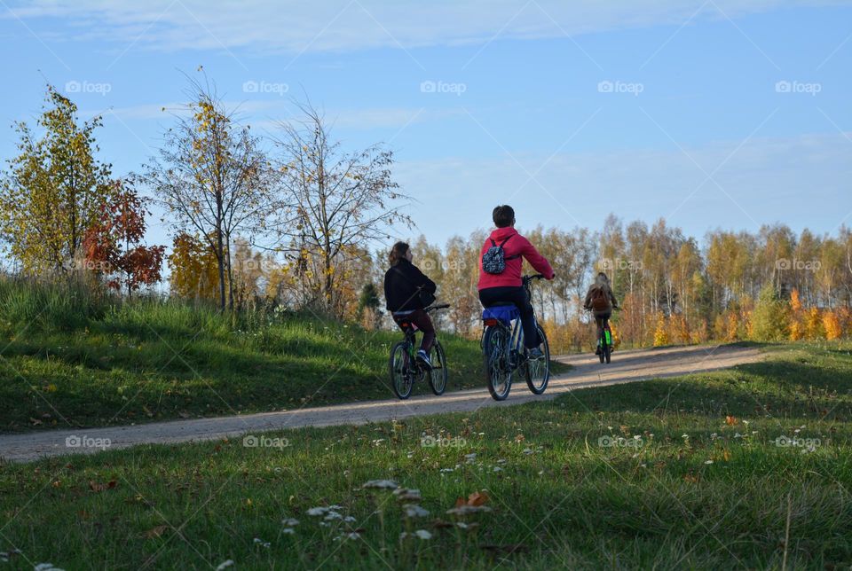 people riding bikes nature landscape