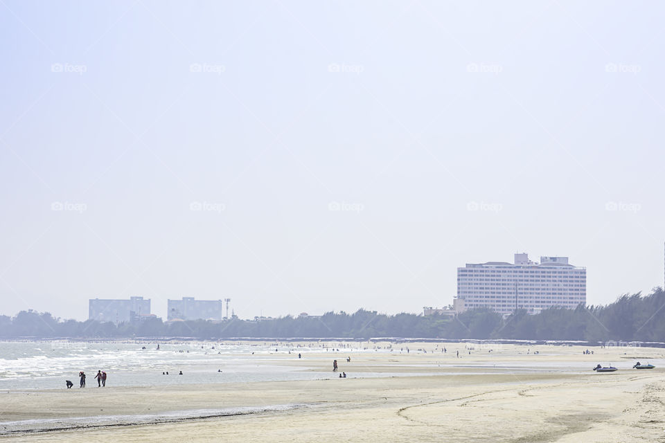 The tourists on the beach in the holidays at Cha am beach. Petchaburi in Thailand. March 24, 2019