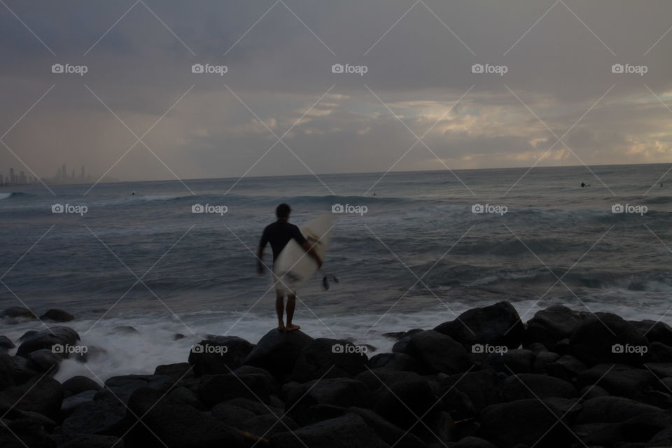 Surfer heading out 