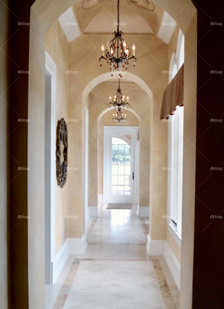 Hallway with arch doorways