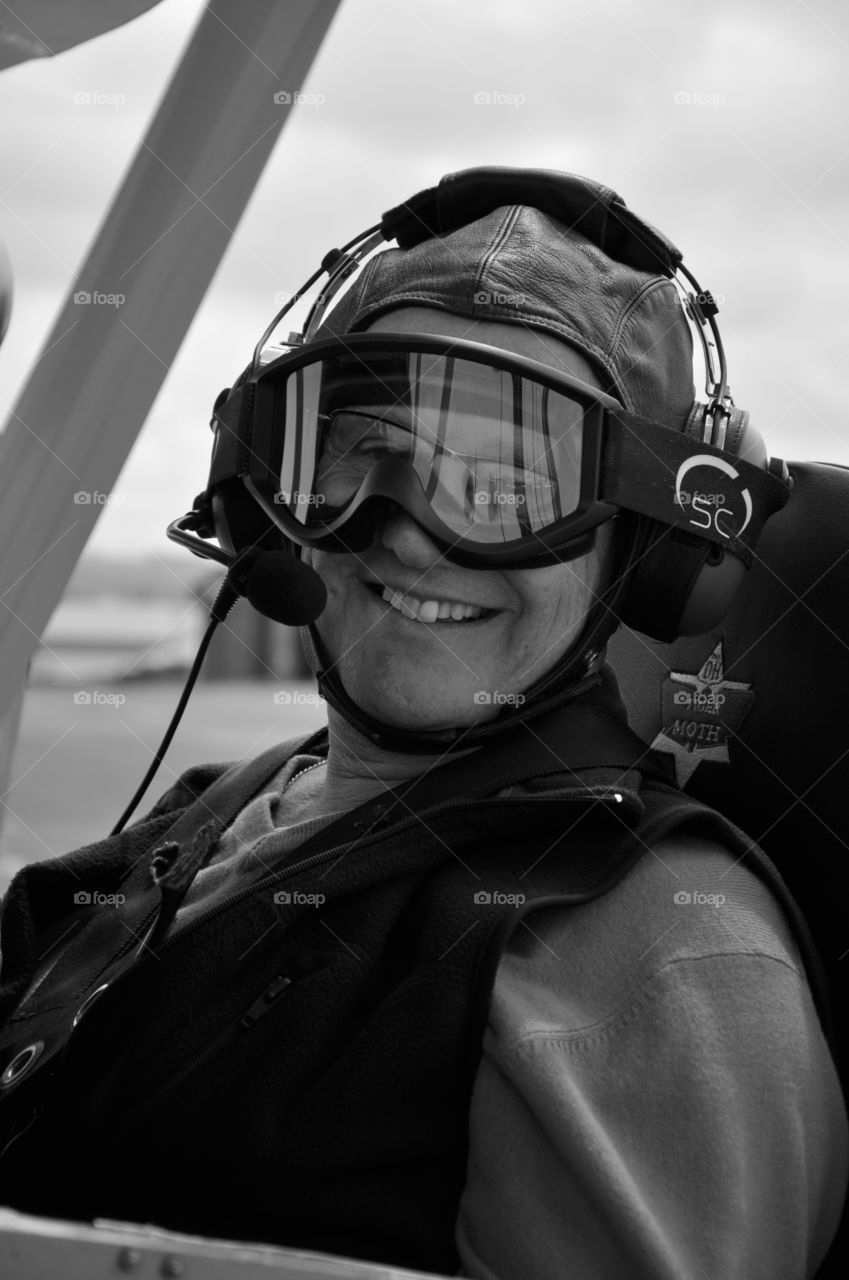Flight pilot in black and white in a tiger moth