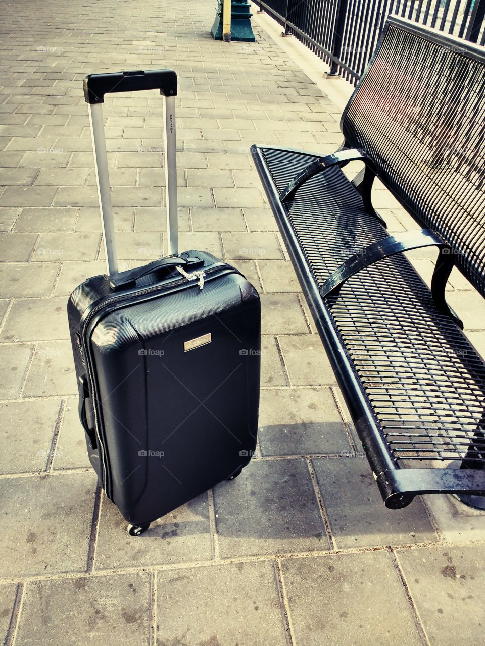 Abandoned suitcase at railway station platform