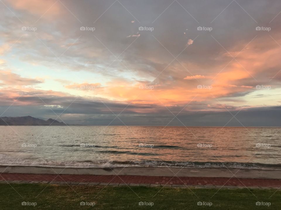 Serene beach landscape during sunset (golden hour)