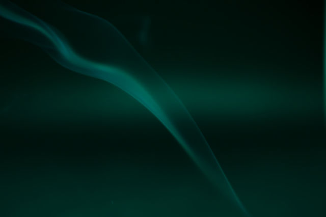 Smoke scented candles on a black background