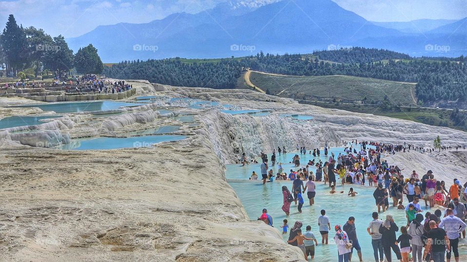 holiday crowds at the cascading travertine pools of hierapolis and Pamukkale