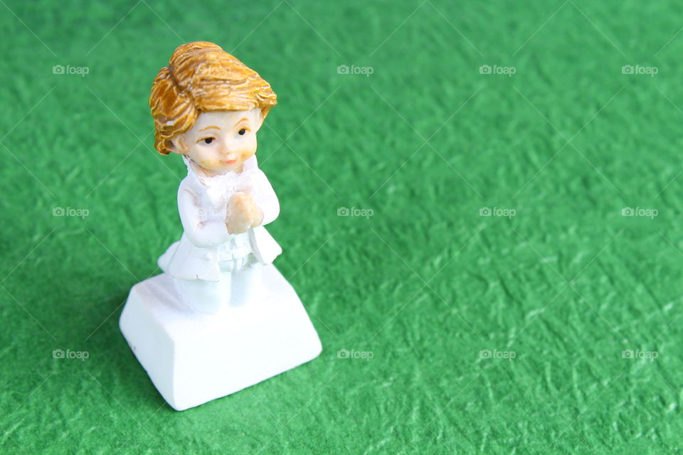 boy praying groom toy