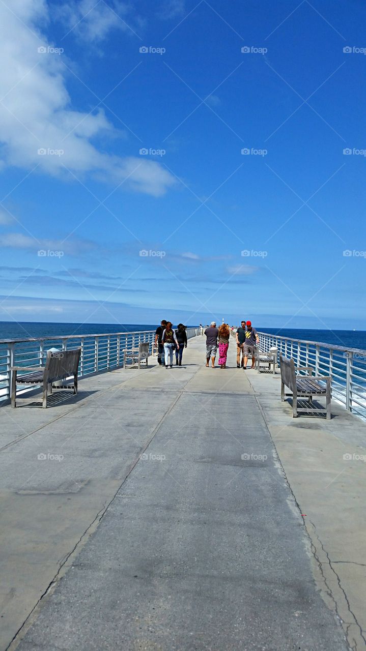 Pier walking. Lone walkers on the pier!