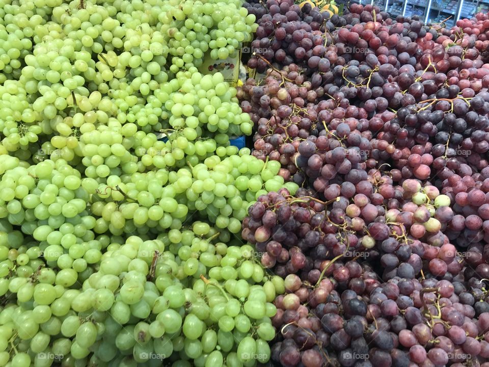 black and green grapes on the street market