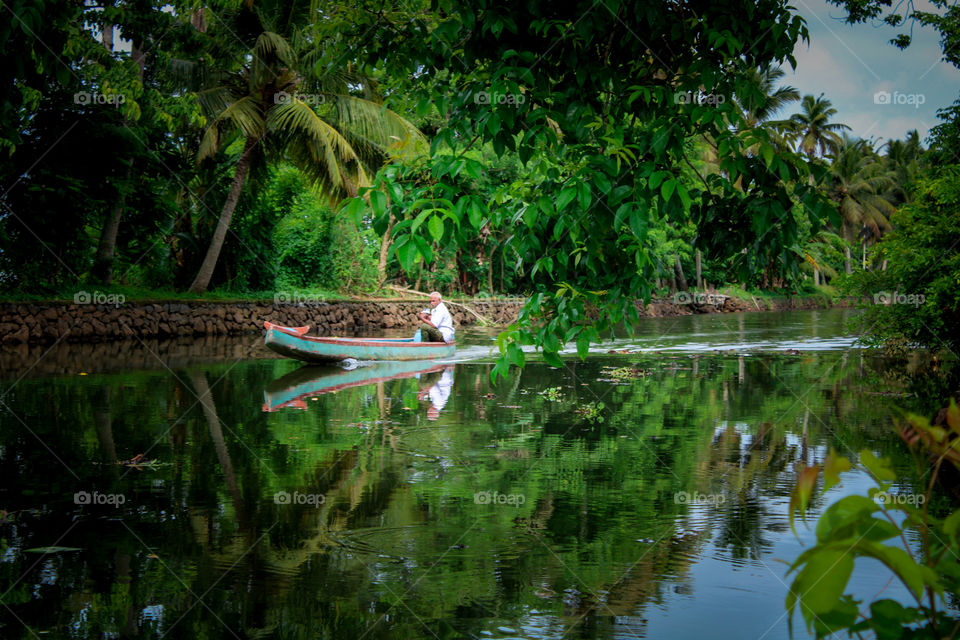 village water transporting in kerala alappuzha. The most common means of transport for the people here are baby boats.