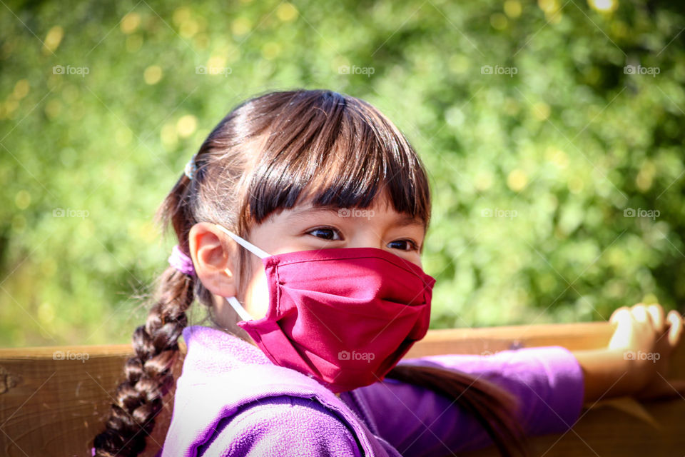 Cute girl in a face mask