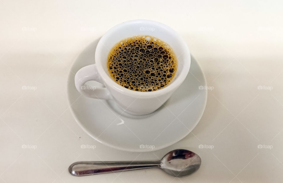A cup of hot black coffee