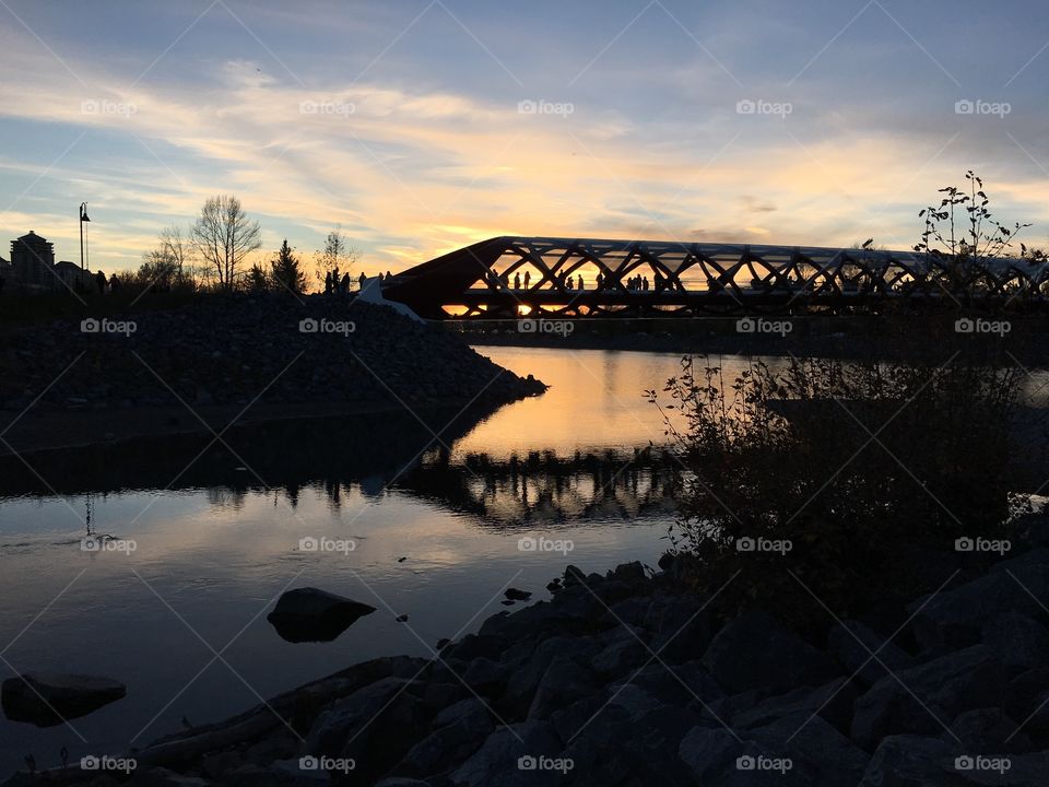 Moonlight stroll. The peace bridge at dusk, Calgary Alberta 
