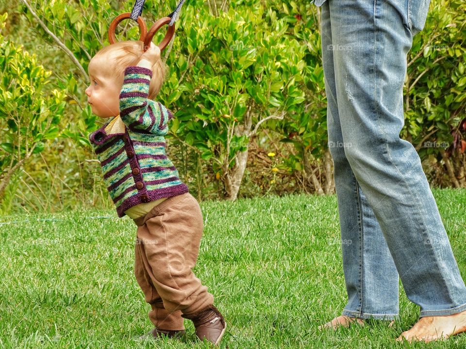 Learning To Walk. Toddler Girl Learning To Walk