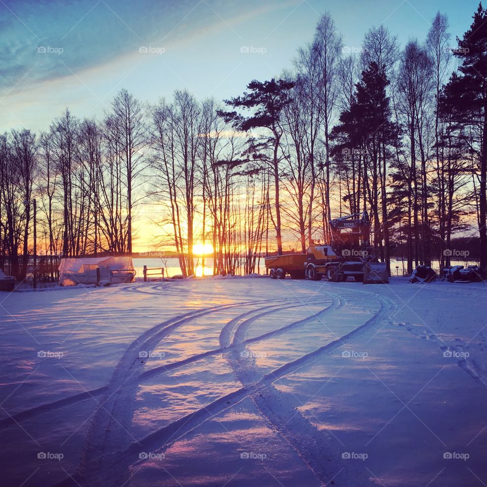 Yellow tractor in snowy landscape 