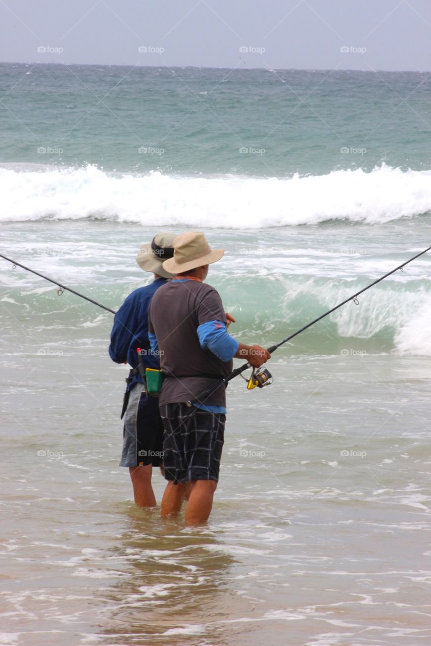 Fishermen. Moving water.