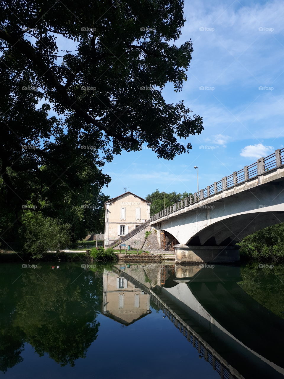 Bridge reflects in the river water