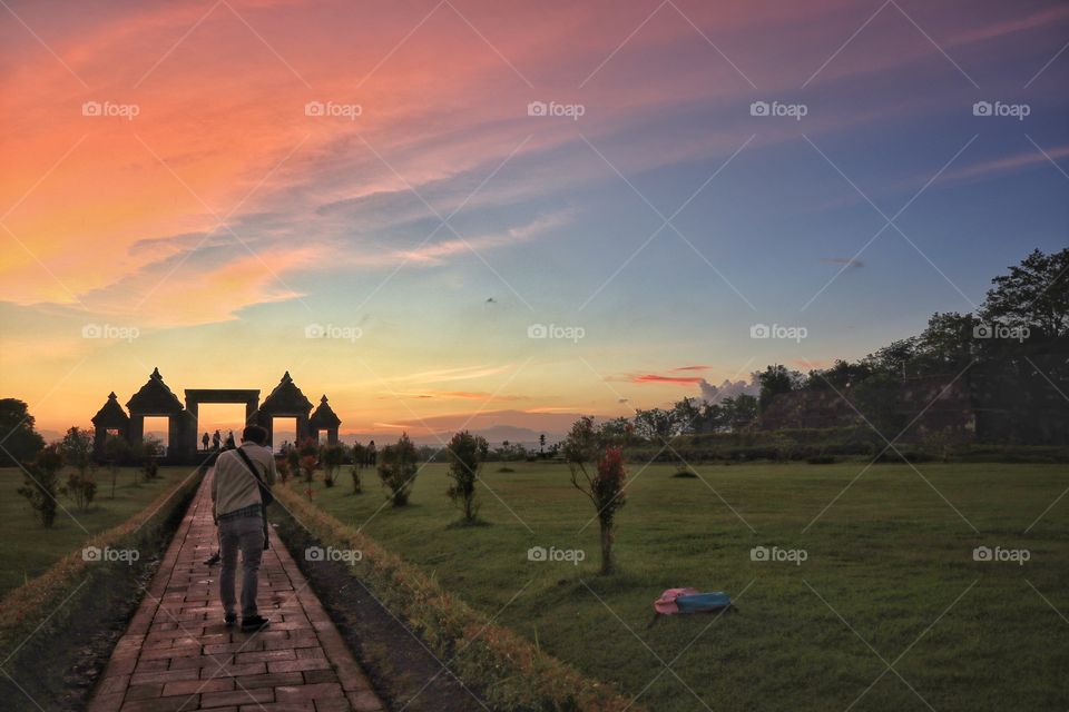 People's enjoying the scenery of sunset at ratu boko archaelogical site, near Jogjakarta, Indonesia