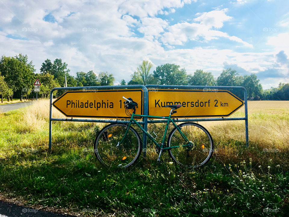Bicycle in the countryside in front of road signs