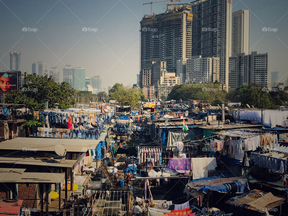 Dhobi Ghat (Mahalaxmi Dhobi Ghat) is a well known open air laundromat (lavoir) in Mumbai, India.The washers, known as dhobis, work in the open to clean clothes and linens from Mumbai's hotels and hospitals.