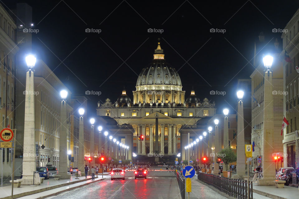 Rome Vatican 18 June 2016. St. Peter's night view from Via della Conciliazione. The road to the Papal Basilica with installed crowd barriers leading to the entrance.
