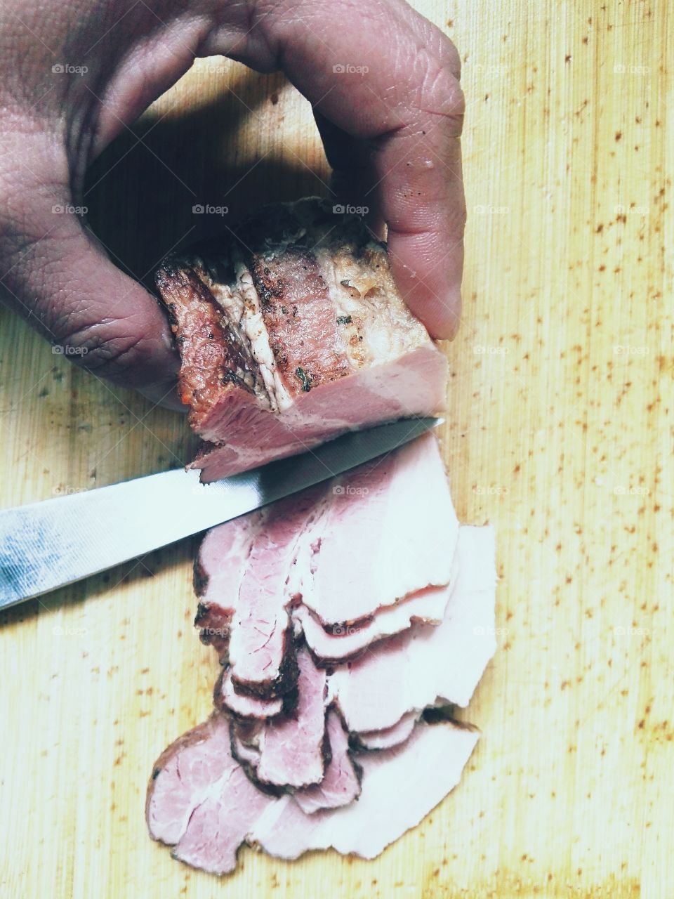 cutting fresh bacon