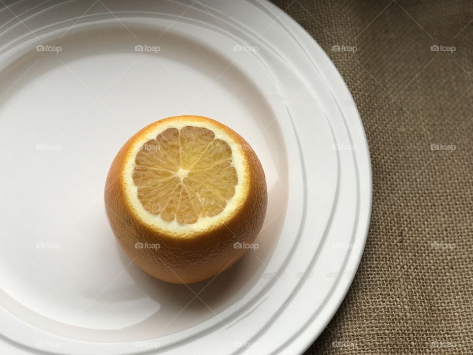 Close-up of orange fruit in plate