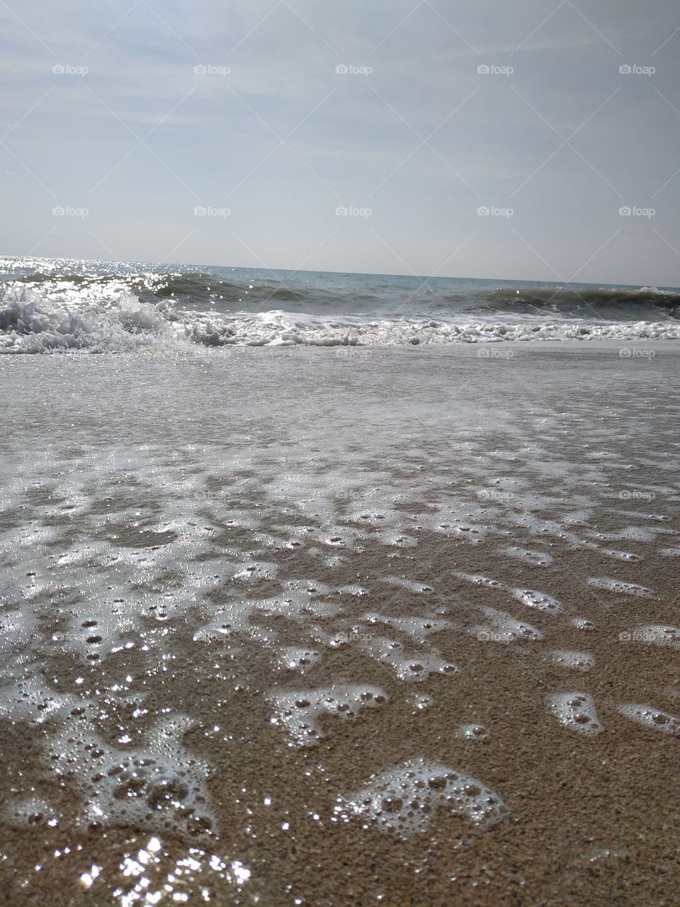 Foam on the beach, ripples and special colors.
Espuma en la playa, olas revueltas con colores especiales.