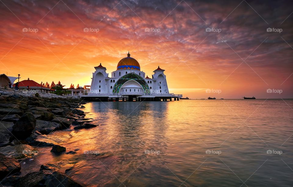 The Rise. Beautiful sunrise over the Malacca Straits Mosque Malaysia