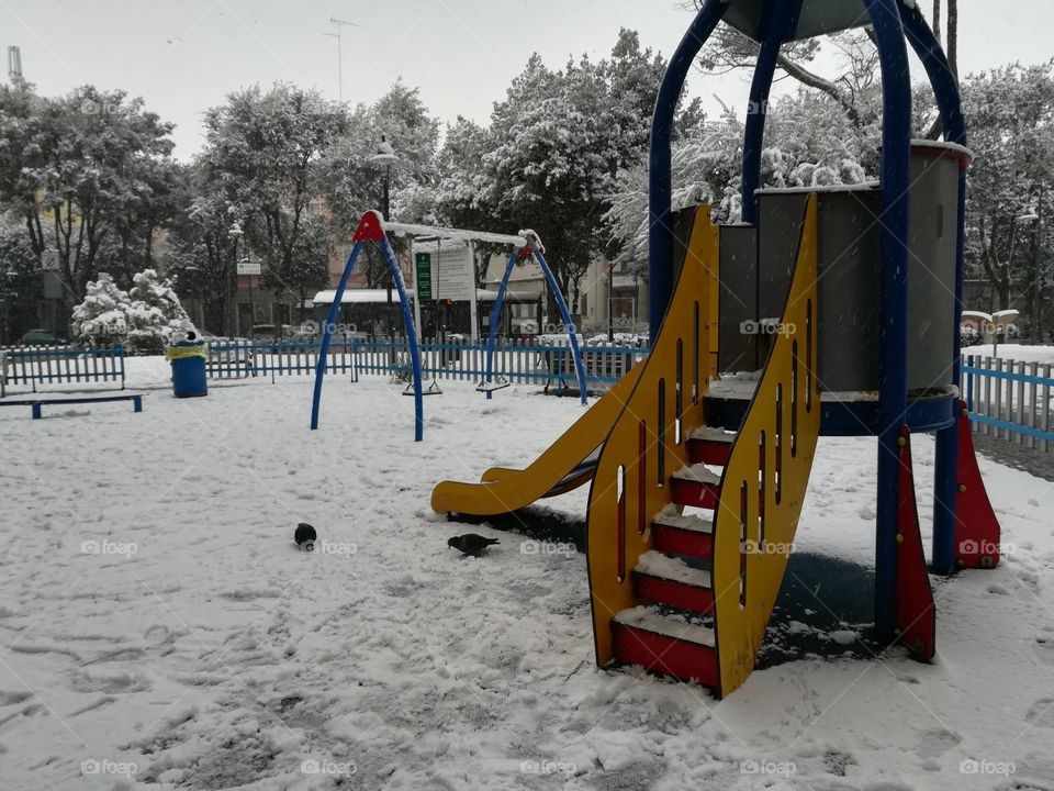 children park in winter snowy time