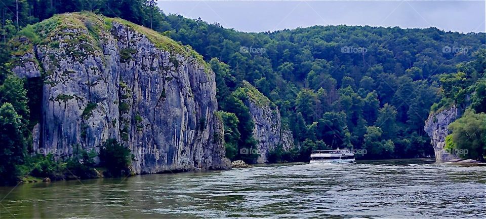 The “Danube” flows past forested cliffs between “Kelheim” and the “Weltenburg Abbey” where it enters the “Donaudurchbruch” or “Danube Gorge”, two sharp turns, then a half loop enclosing the peninsula where the abbey sits. 2024. Hypnotic Productions