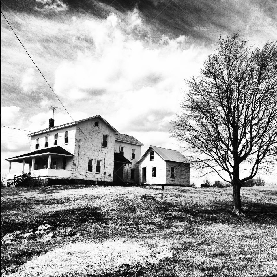 Spooky abandoned farmhouse black and white 