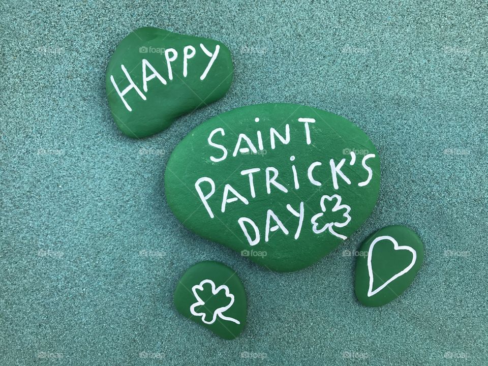 Saint Patrick's Day stones over green sand