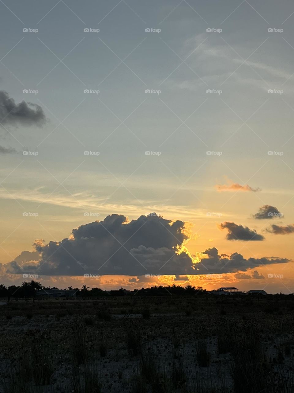 Every cloud has a silver lining: sundown at Gdh. Thinadhoo, a famous southern island of Maldives 