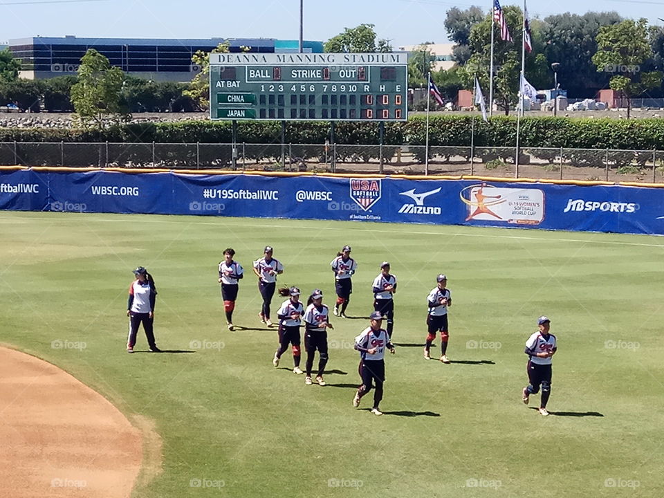 Softball game viewed from up above.