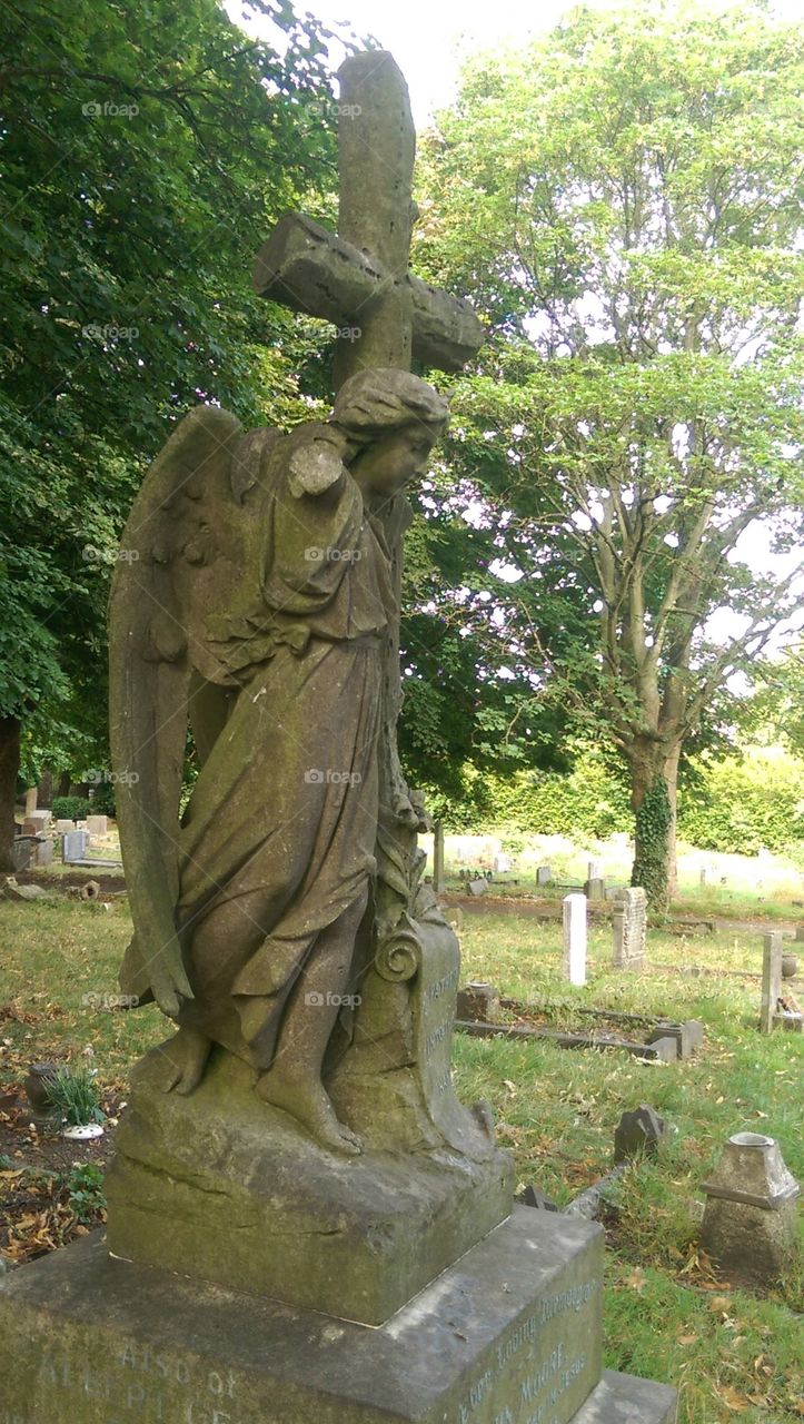 gothic angel in graveyard