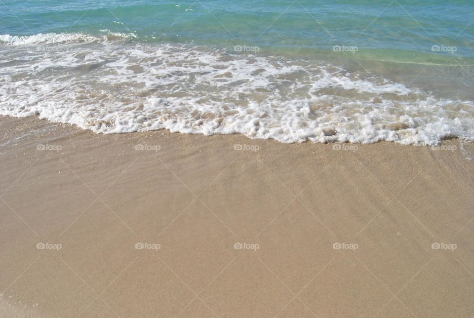 Waves hitting the shores of a beach