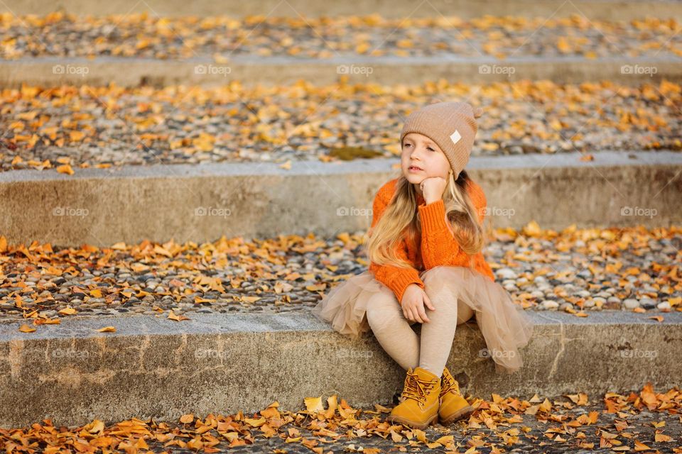 Little Caucasian girl feeling sadness outdoor 