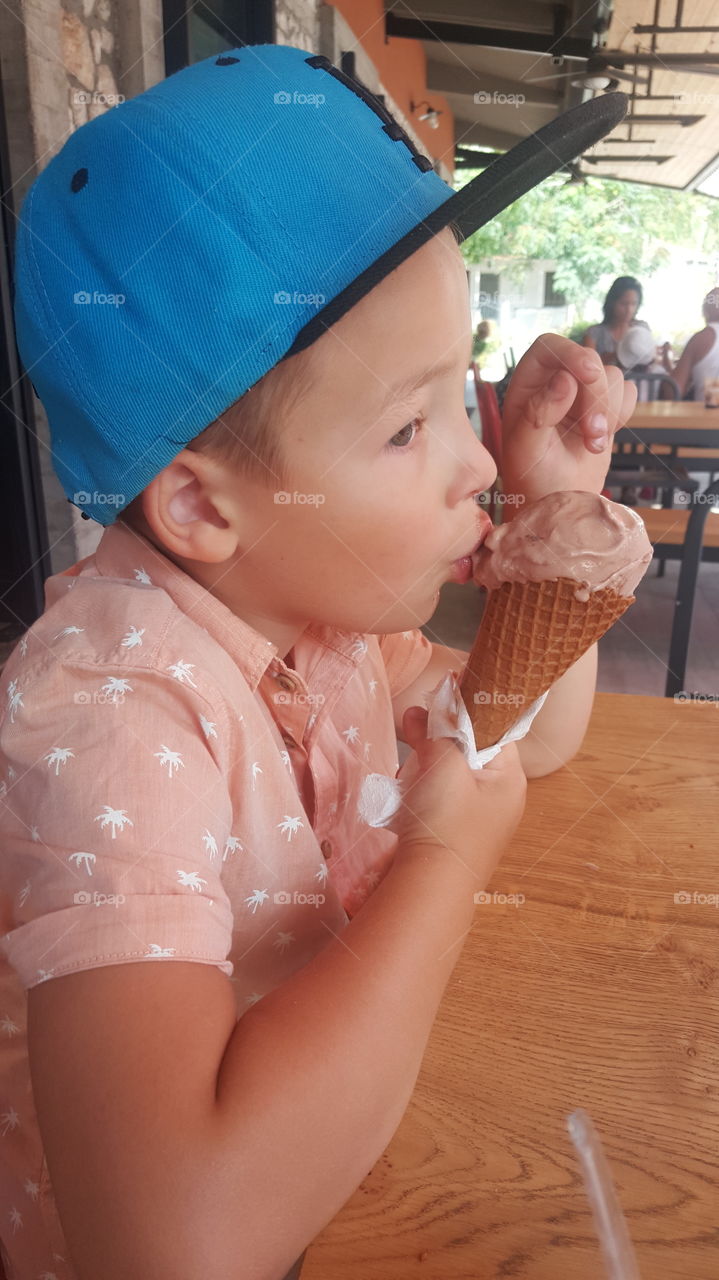 boy eating chocolate ice cream
