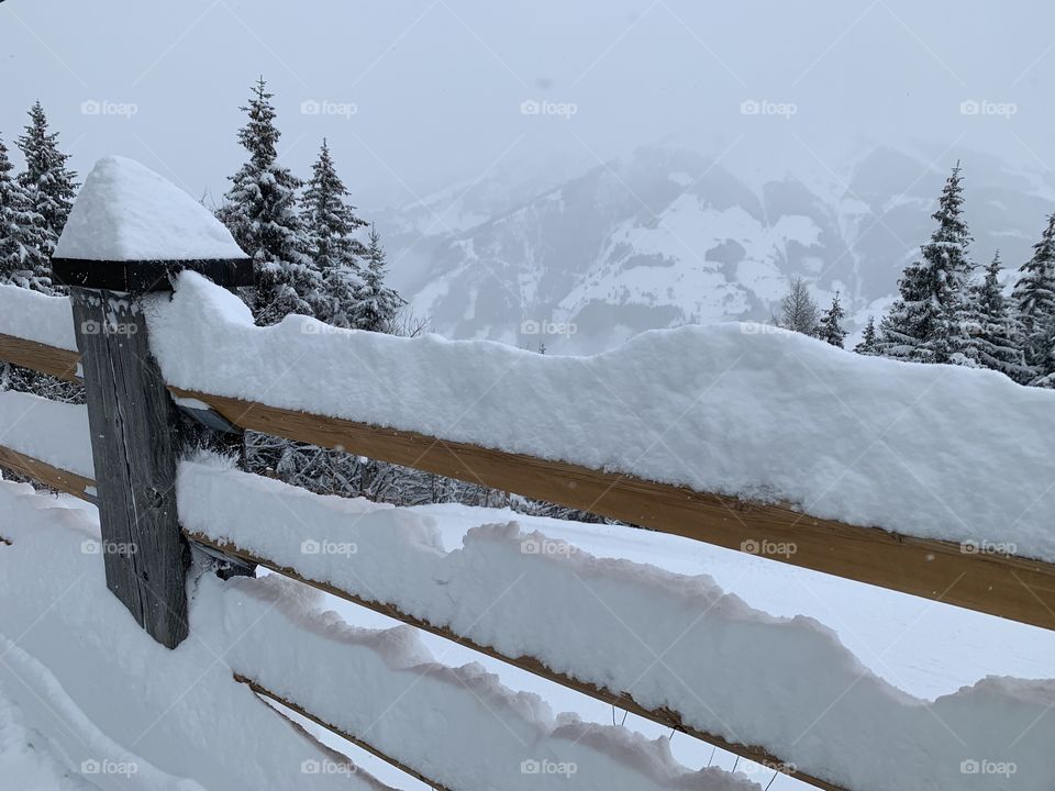 Snow on fence