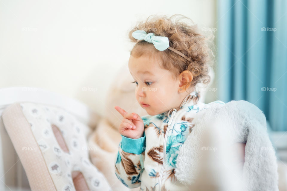 Cute little girl reading a book