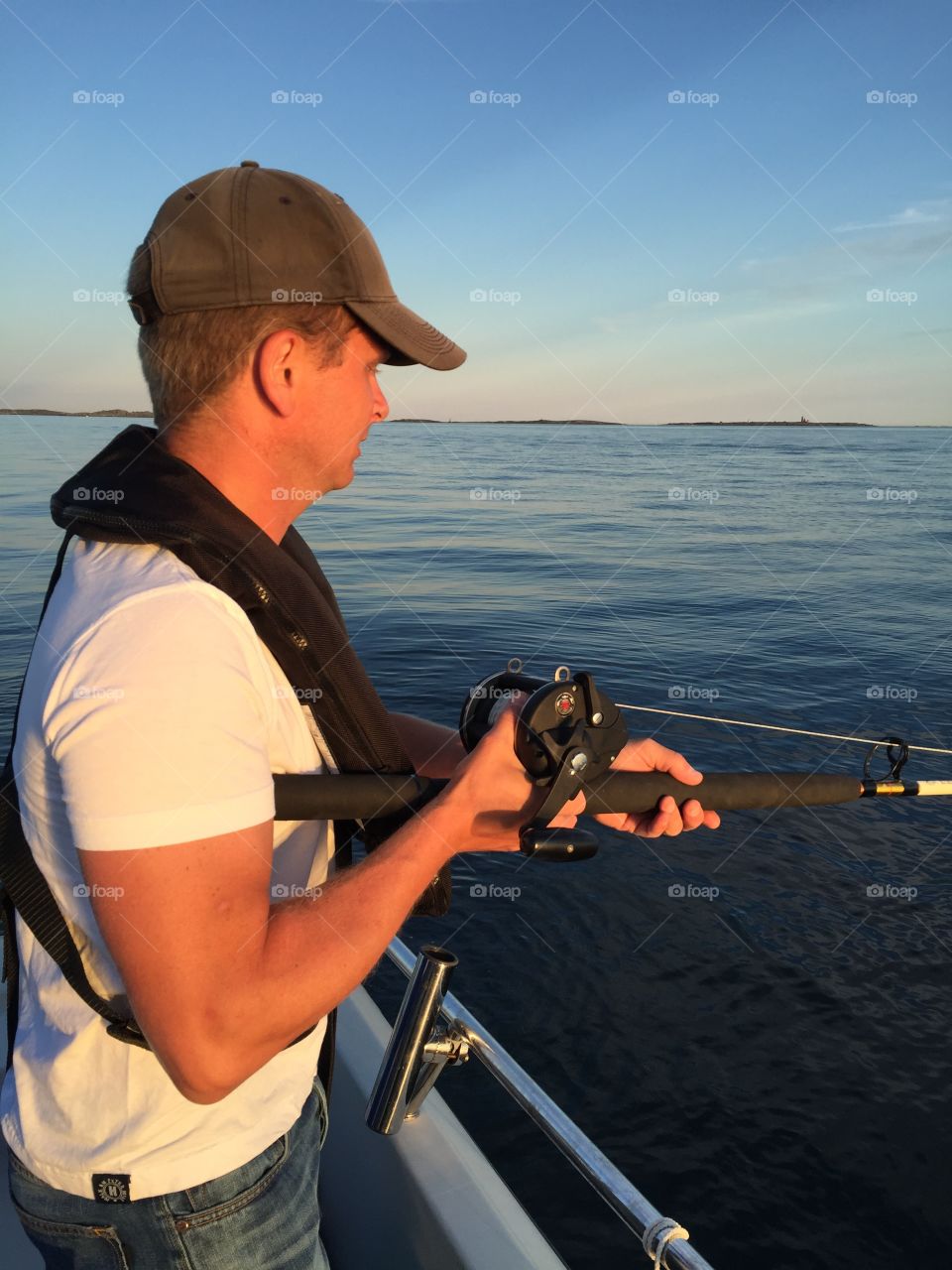 Close-up of a man fishing in sea