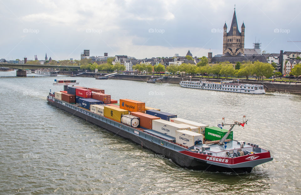 International Container Ship on the way at the Rhine River in Cologne NRW Germany Europe