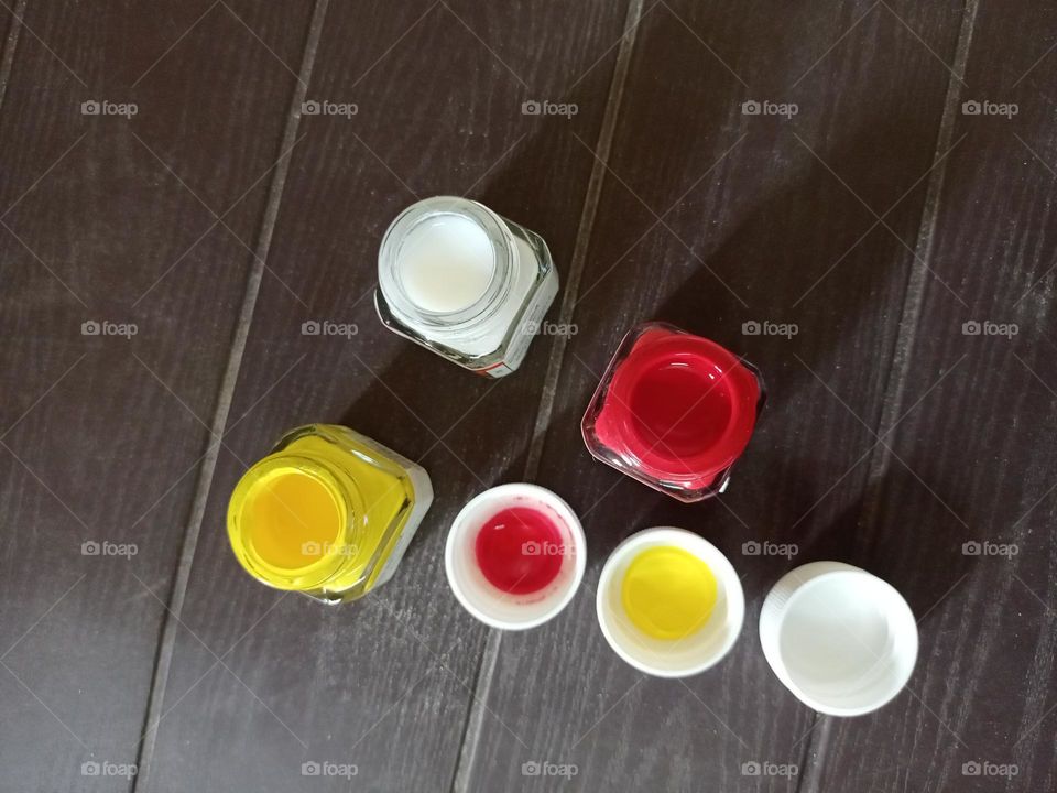 acrylic paint botals with nice  wooden background closeup photo