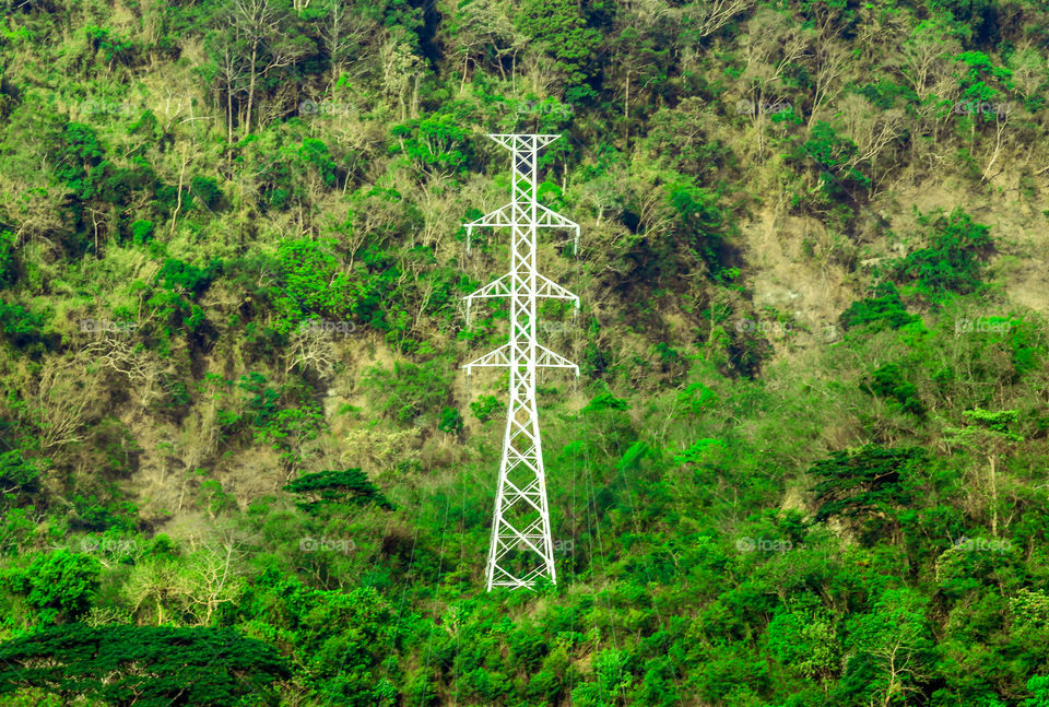 Electric Power Tower line on the edge of the Mountain